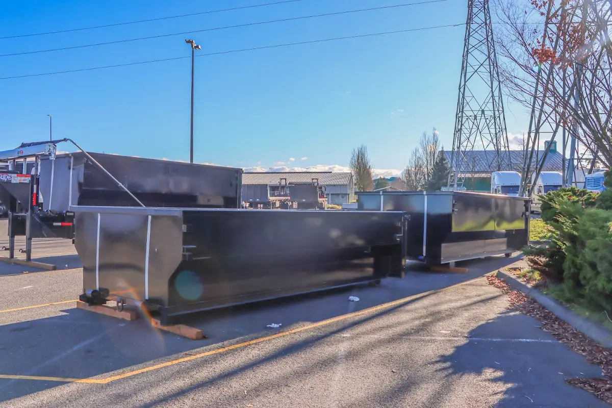 Roll-off dumpster ready for waste disposal at job site for 2 Yard Dumpster Rental in Denton